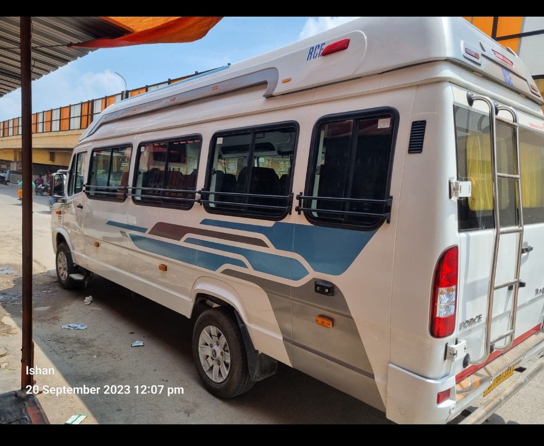 Side profile of 17-seater Tempo Traveller rental vehicle in Prayagraj
